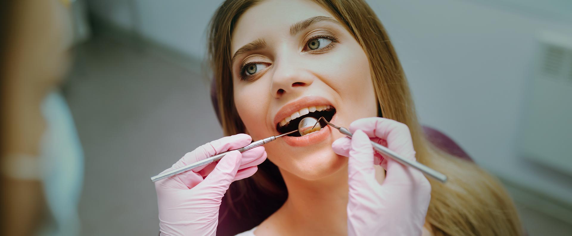 Woman having gum disease inspection at the clinic